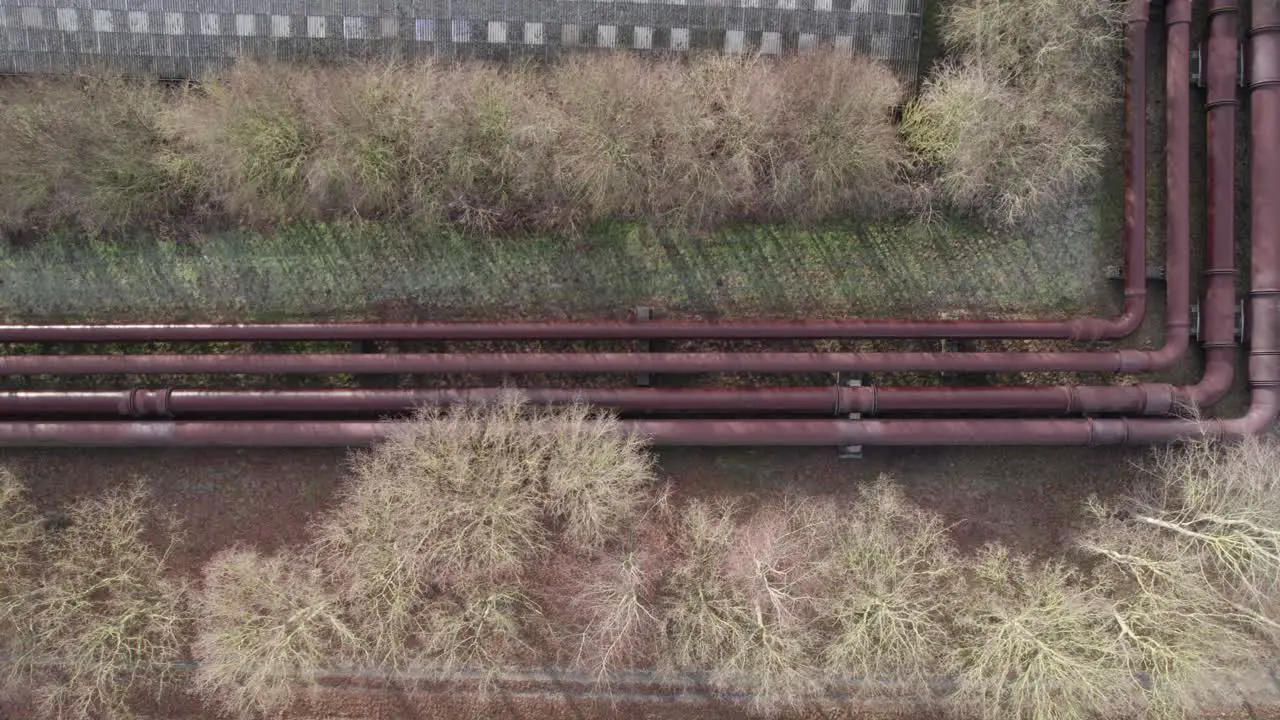 Industrial Cooling Water Pipes Next to Industry Buildings Truck Shot