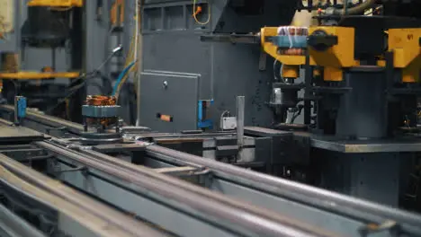 Metal detail with copper wire moving on automatic conveyor on factory