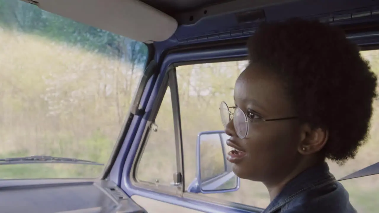 A Young Female Having A Conversation During A Roadtrip In The Caravan