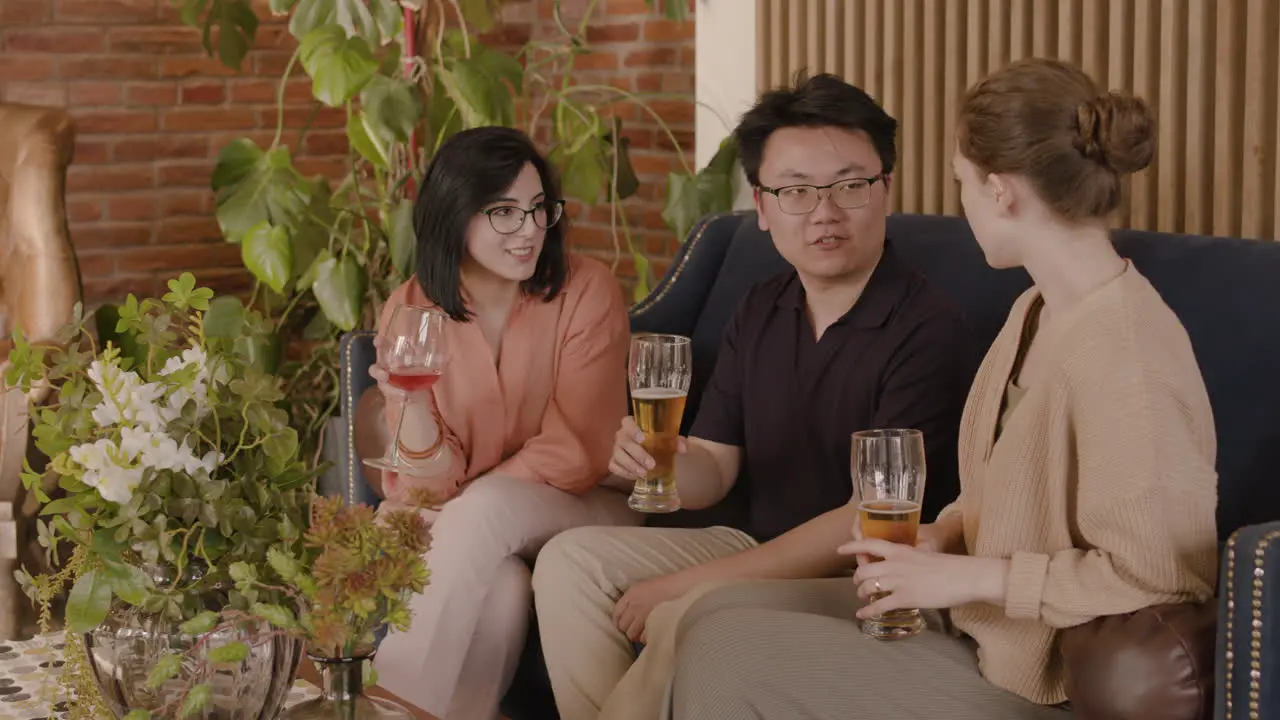 An Young Man Talking With Two Young Beautiful Girls 1