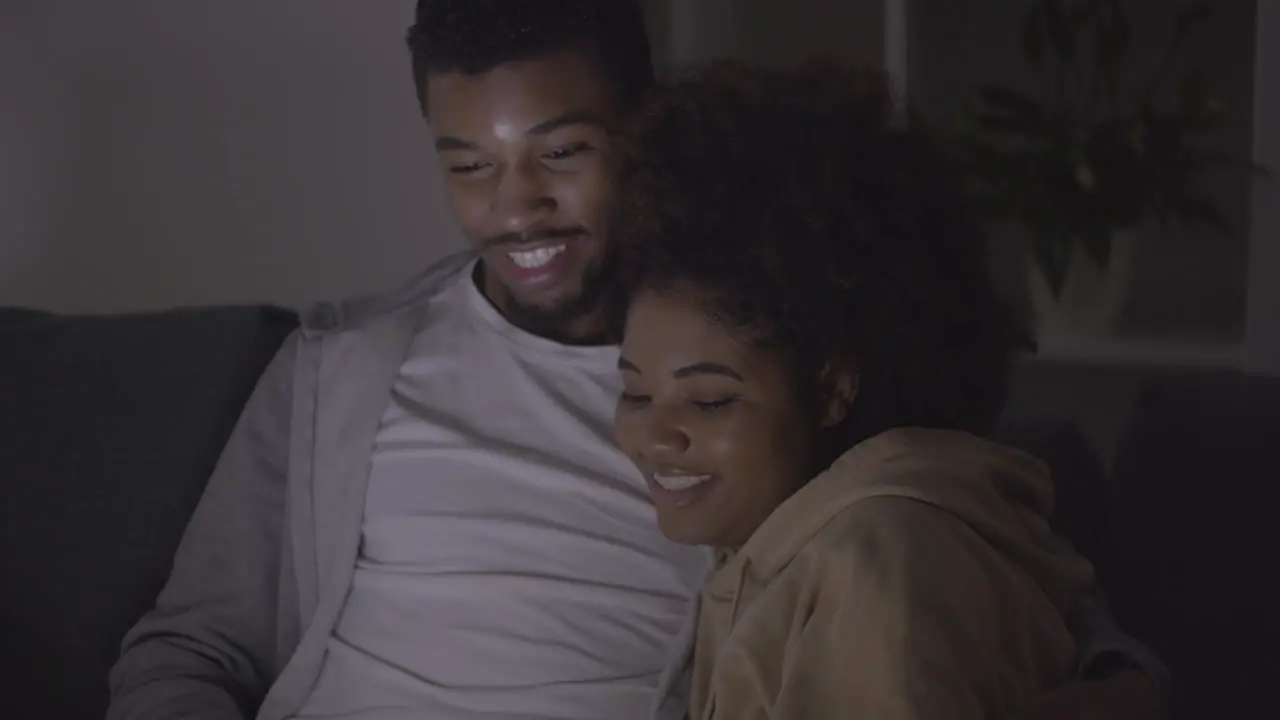 Young Couple Choosing A Movie To Watch On The Laptop 1