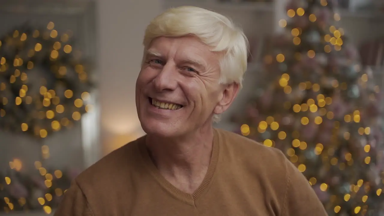 Portrait Of Old Happy Man Looking At The Camera