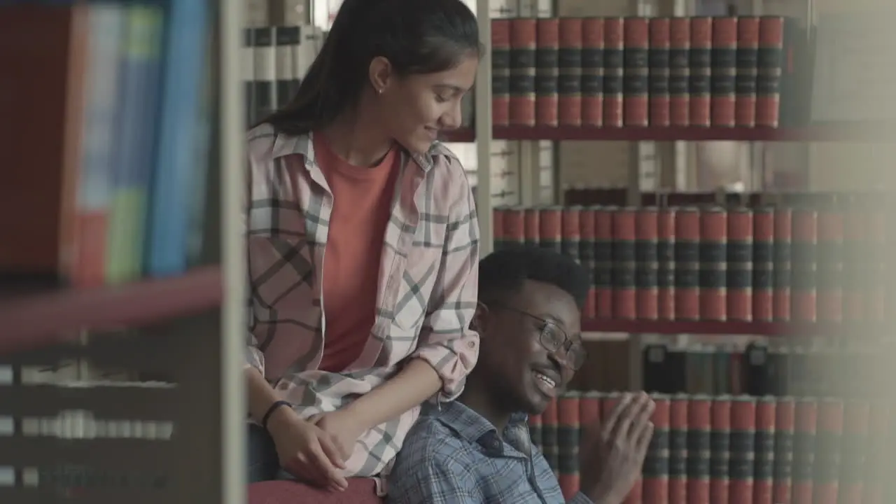 Pretty Girl And Handsome Black Boy Studying In The Library