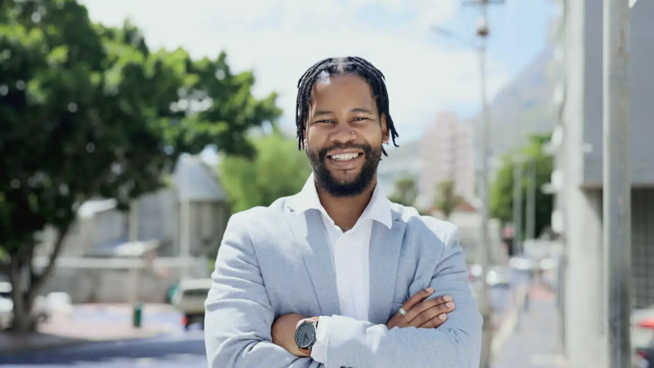 Portrait of happy African businessman laughing