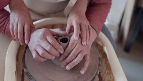 Love pottery and hands of old couple molding