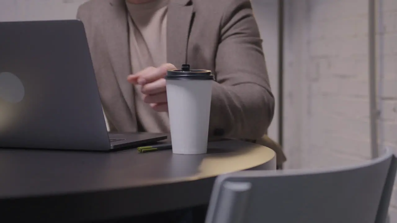 Stressed Businessman Checking Time Closing Laptop Computer And Leaving The Meeting Room