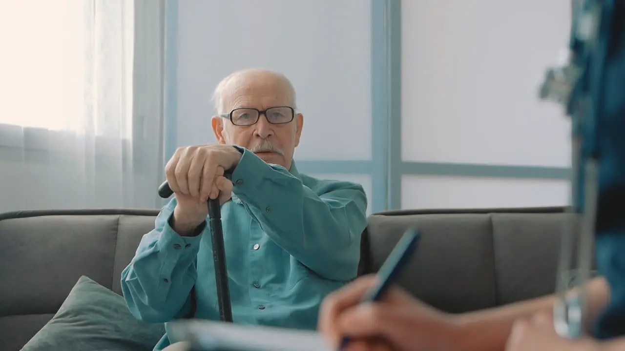 Ederly Man With Cane In The Nursing Home