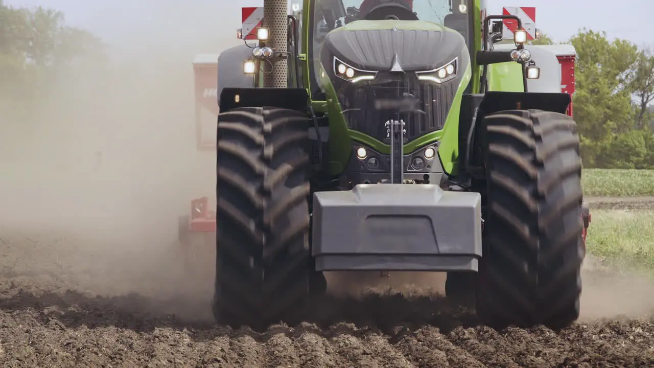 Tractor field Agricultural tractor driving on arable field Agricultural field