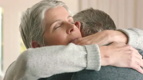 Sad senior couple hug gives support