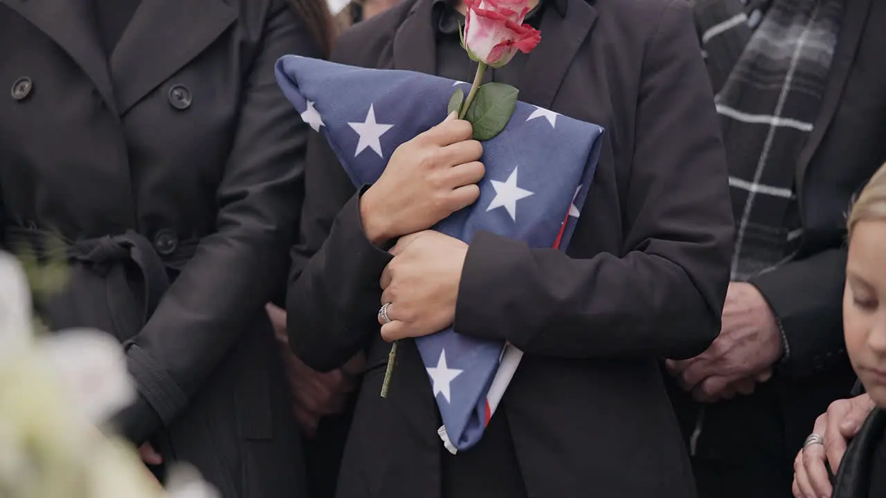 Funeral graveyard and woman with American flag