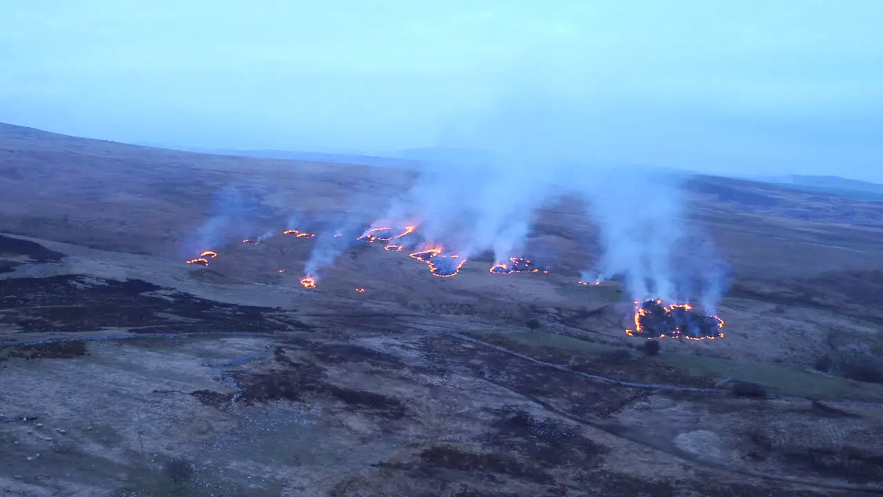 Beautiful cinematic aerial shot flying over burning land