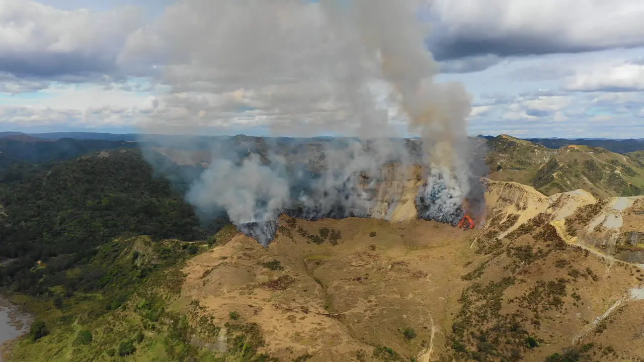 Aerial view of global warming in action as a wildfire burns in a drought stricken landscape