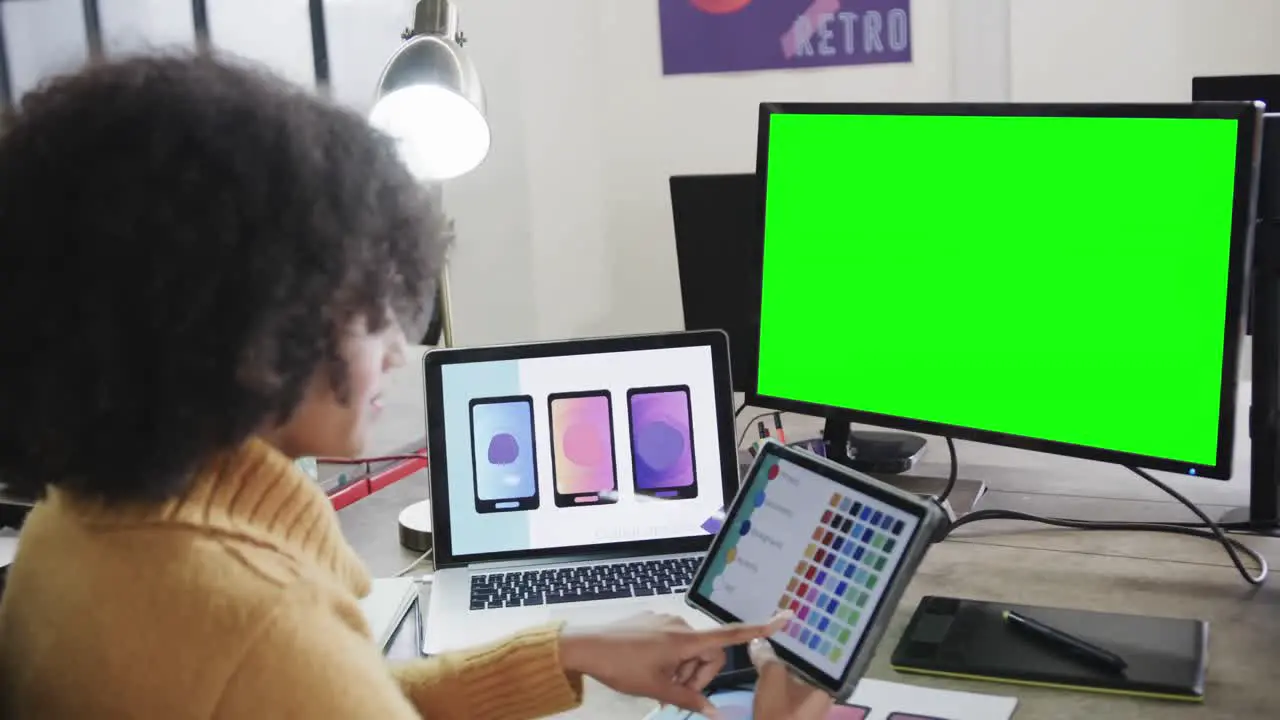 African american businesswoman on video call with green screen