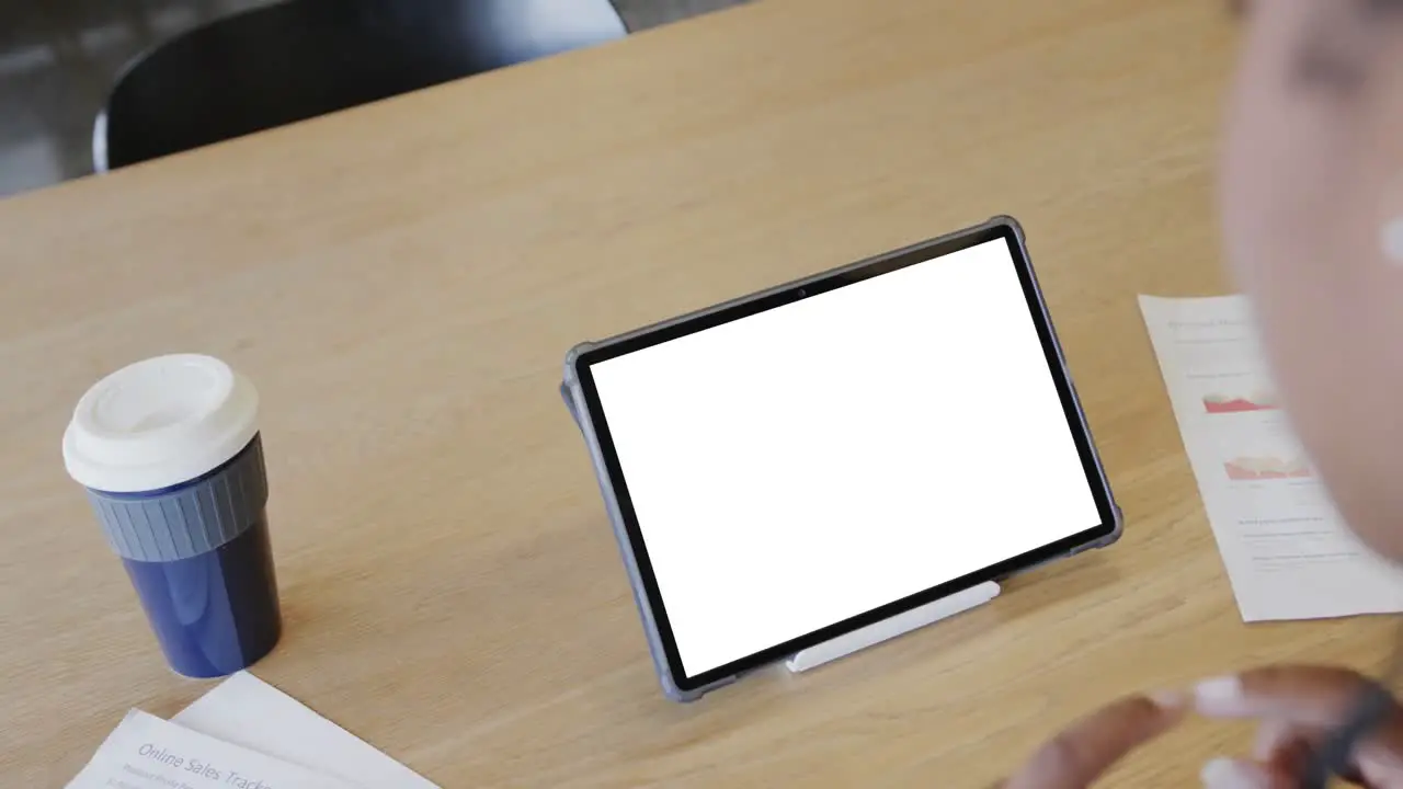 African american businesswoman on tablet video call with blank screen