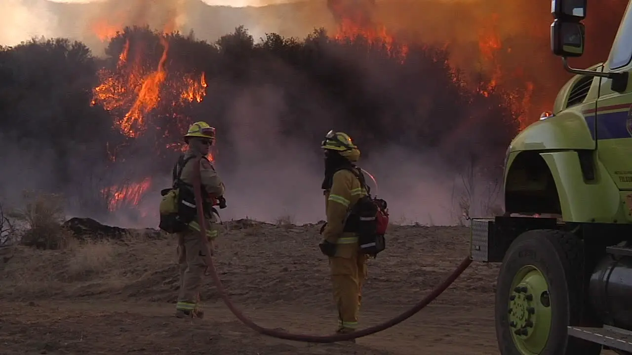 Firefighters Look On As A Blaze Burns Out Of Control In California 7