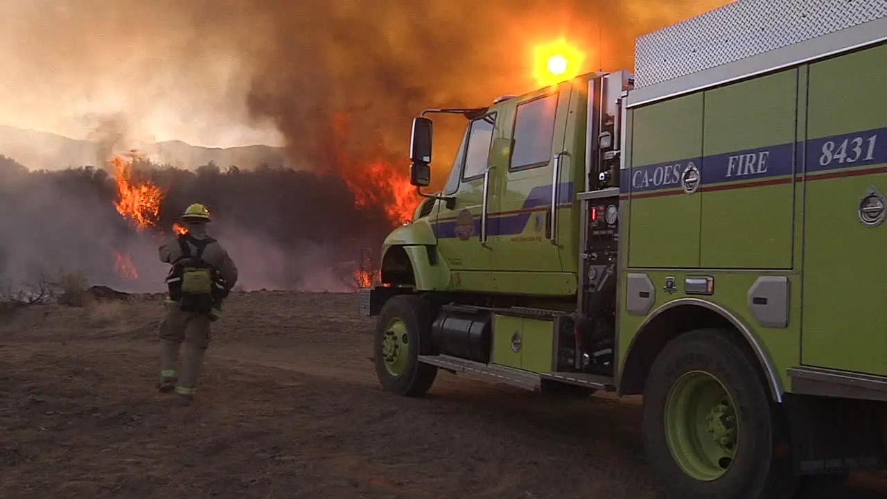 Firefighters Look On As A Blaze Burns Out Of Control In California 6