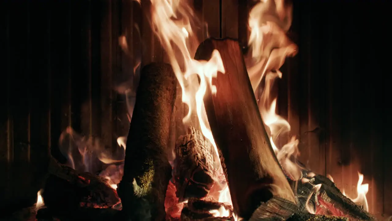 Wood Is Burning In A Modern Fireplace In Slow Motion