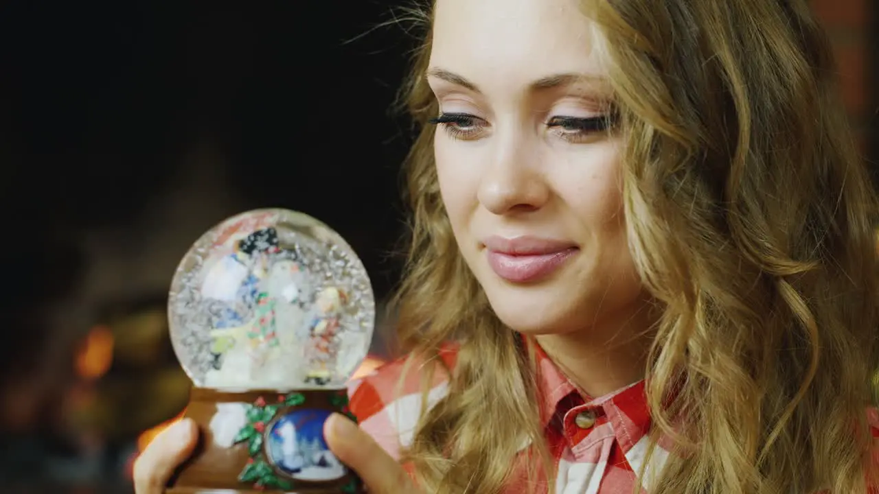 A woman looks at a toy ball 1