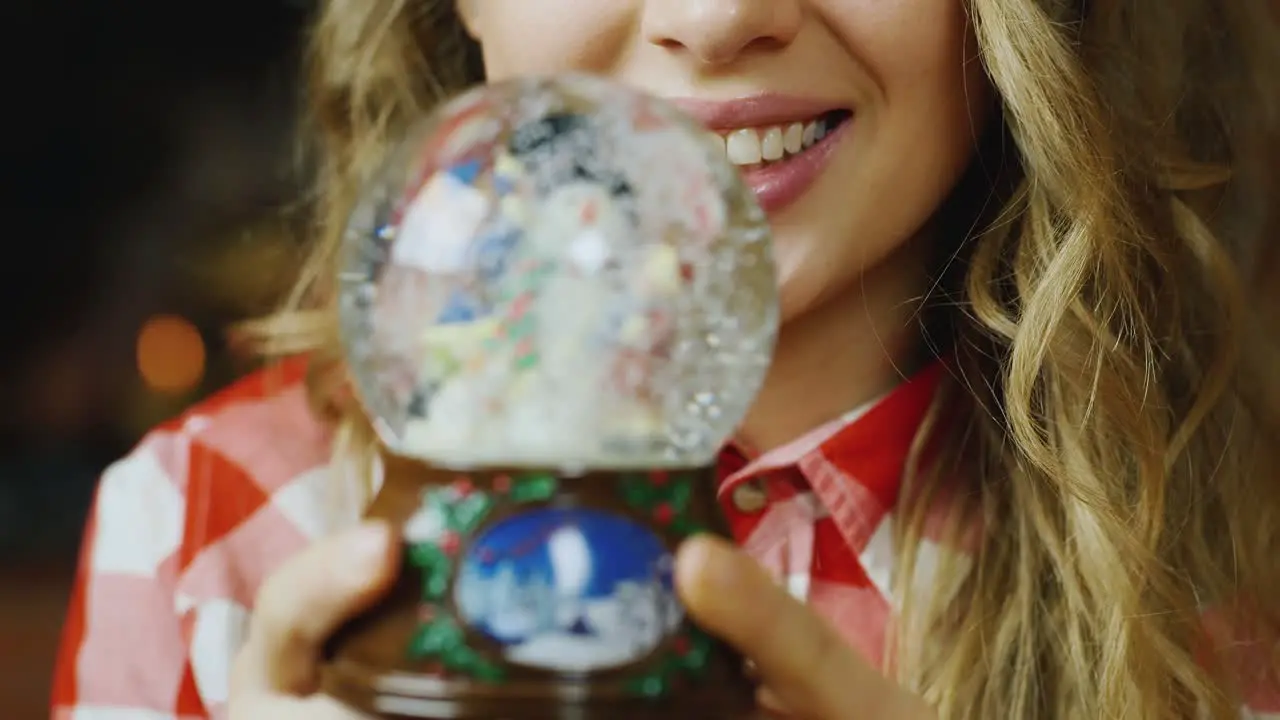 A woman looks at a toy ball