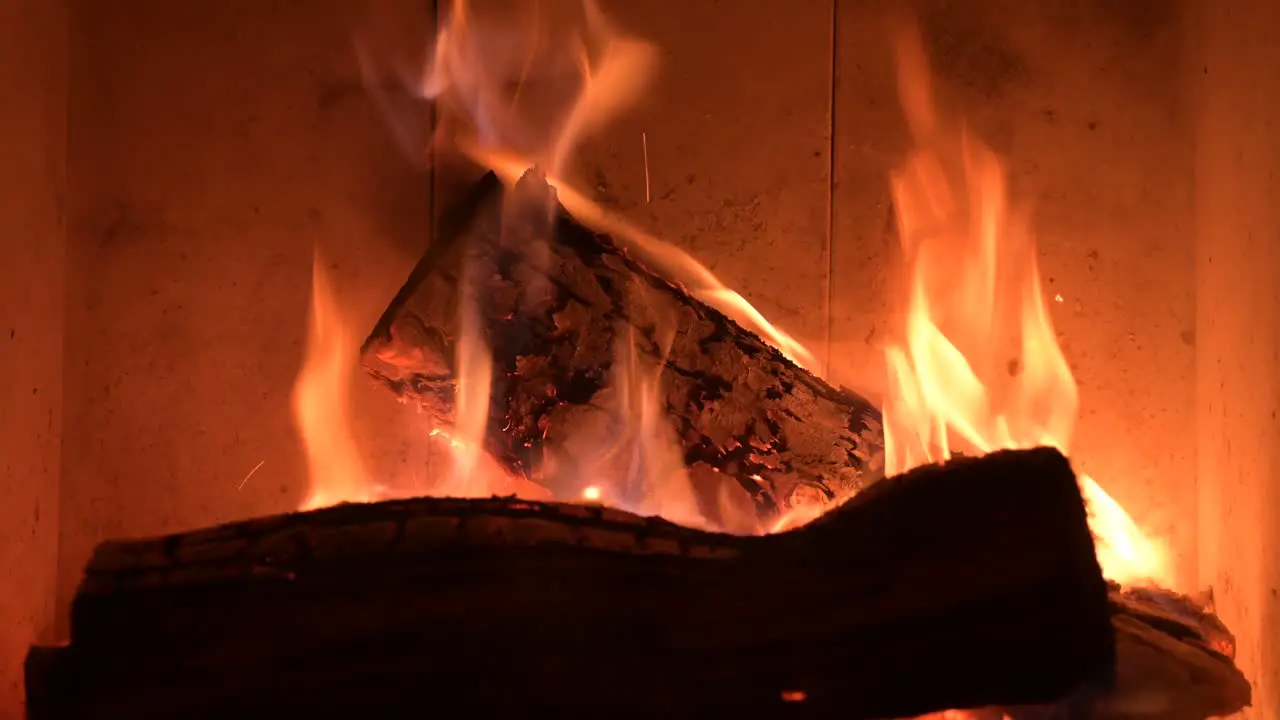 close up of fireplace fire burning piece of wood for heating house during war crisis