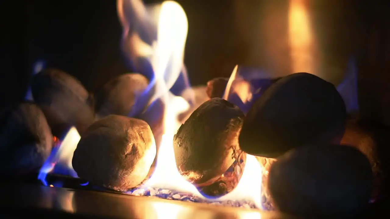 Closeup of fire burning in a modern stainless steel gas fireplace