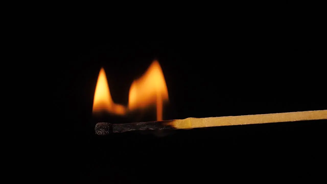 A burning match with a large flame