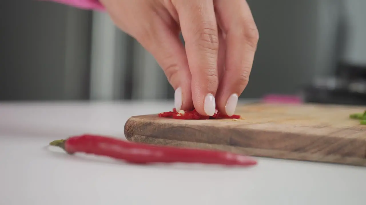 Spicy hot red peppers close-up ingredients on cutting board