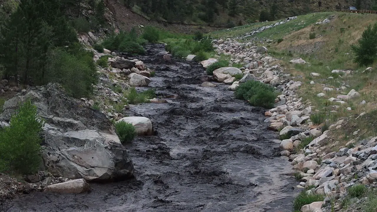 A mudslide turns the Big Thompson river black after a summer storm near Glen Haven Colorado July 15 2022