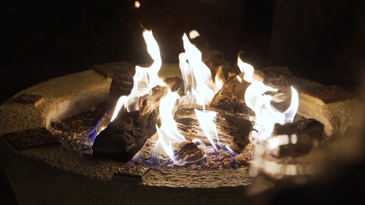 Fire burning in fire pit in slow motion