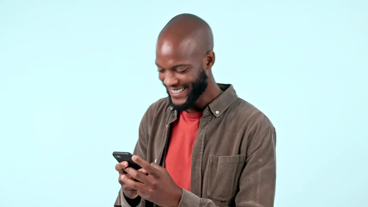 Man phone and celebration in studio for success