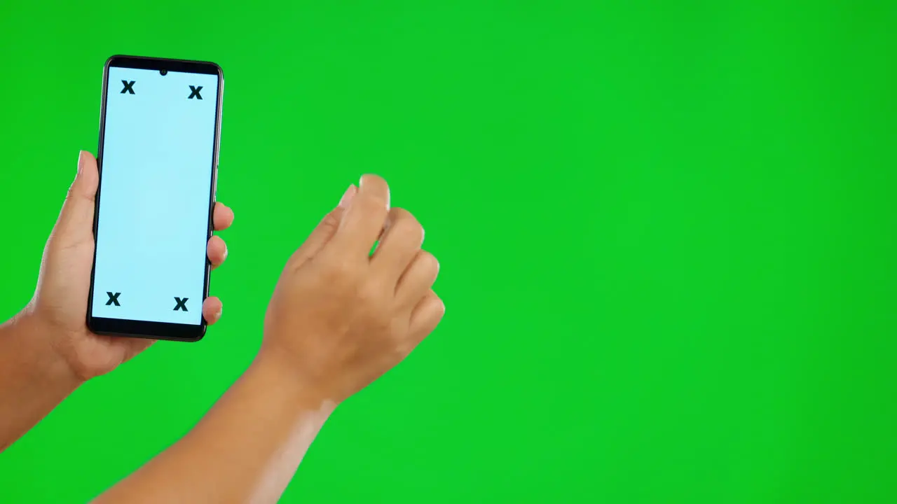 closeup hand and smartphone with green screen