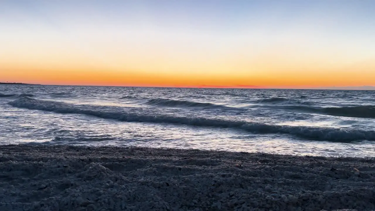 shot of sea waves during sunset in yucatan mexico