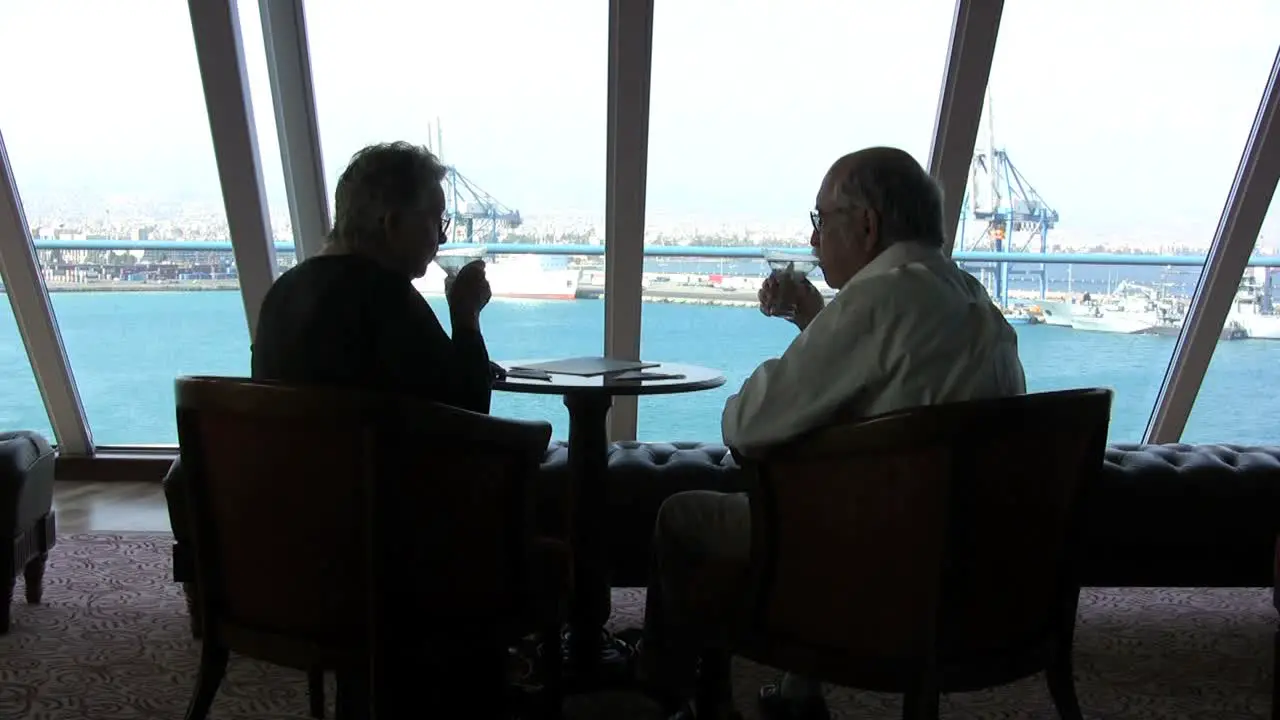 Senior couple toasting on a ship