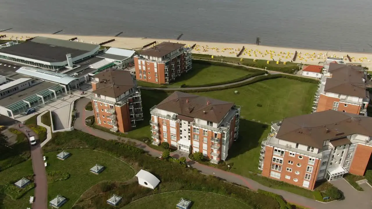 Drone footage of 4 cozy vacation homes on the beach with a view of the North Sea