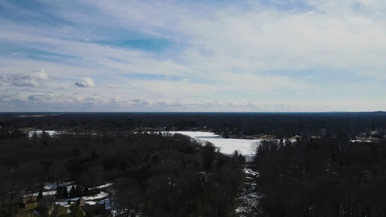 Panning over the surface of Mona Lake covered in ice