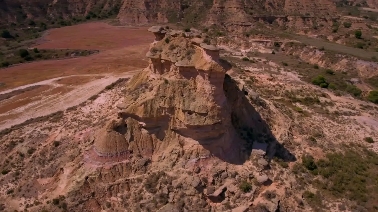 Mid-speed flight around a cliff in a desert environment