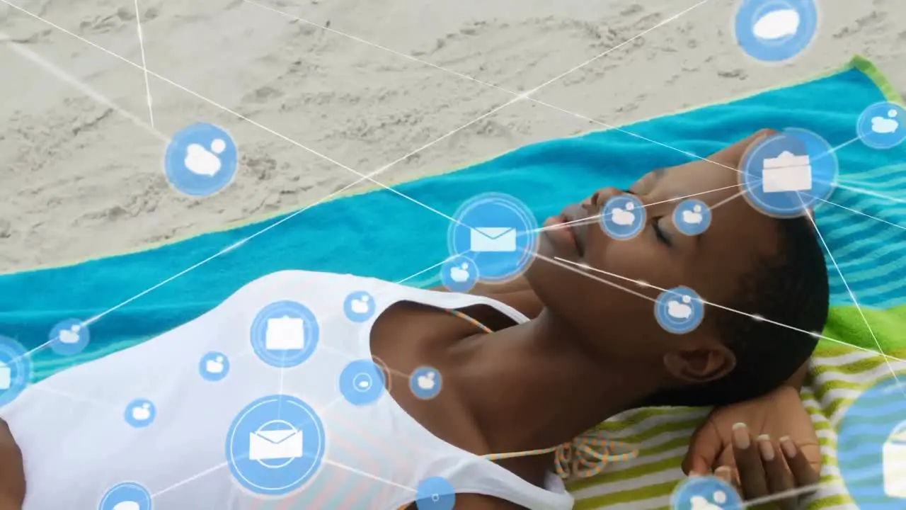 Network of digital icons against african american woman sleeping at the beach