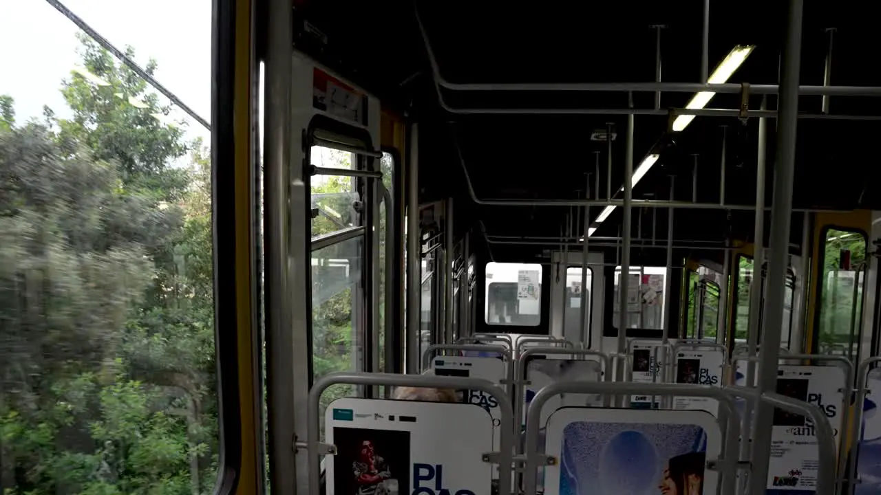 Inside View Of Funicular Travelling Past Trees In Naples