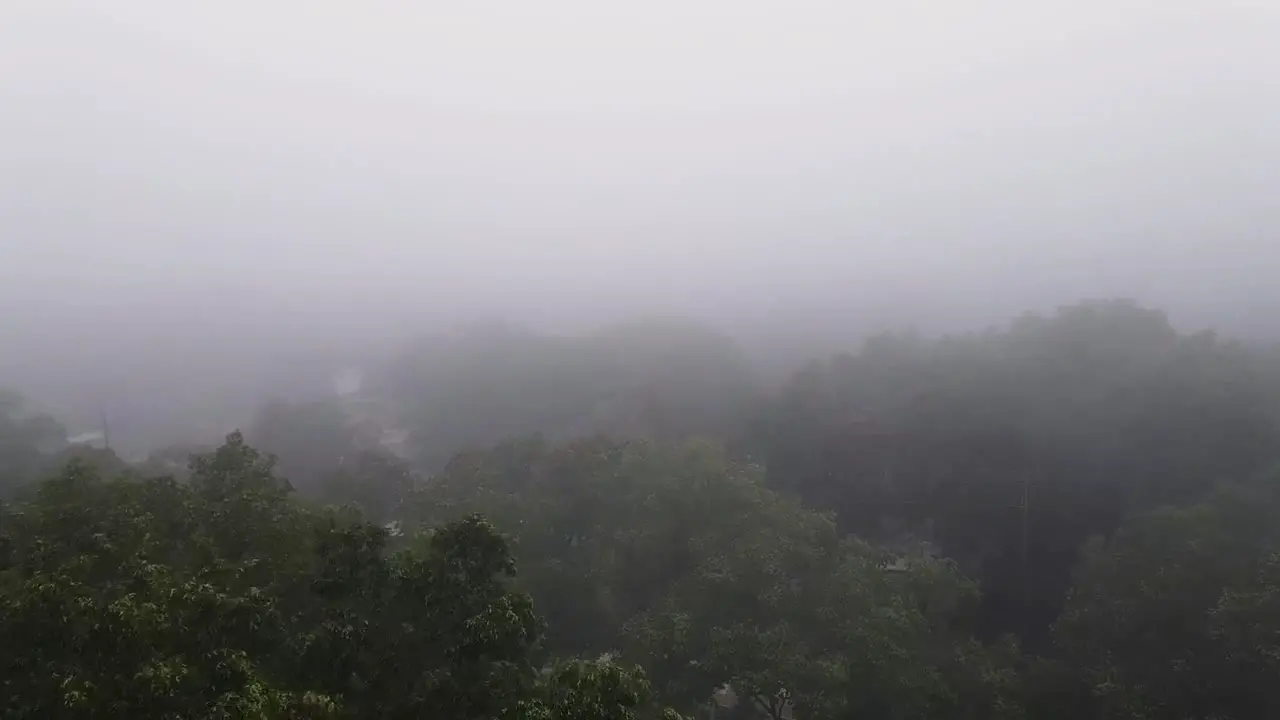 Aerial drone footage of a foggy morning with forward traveling motion