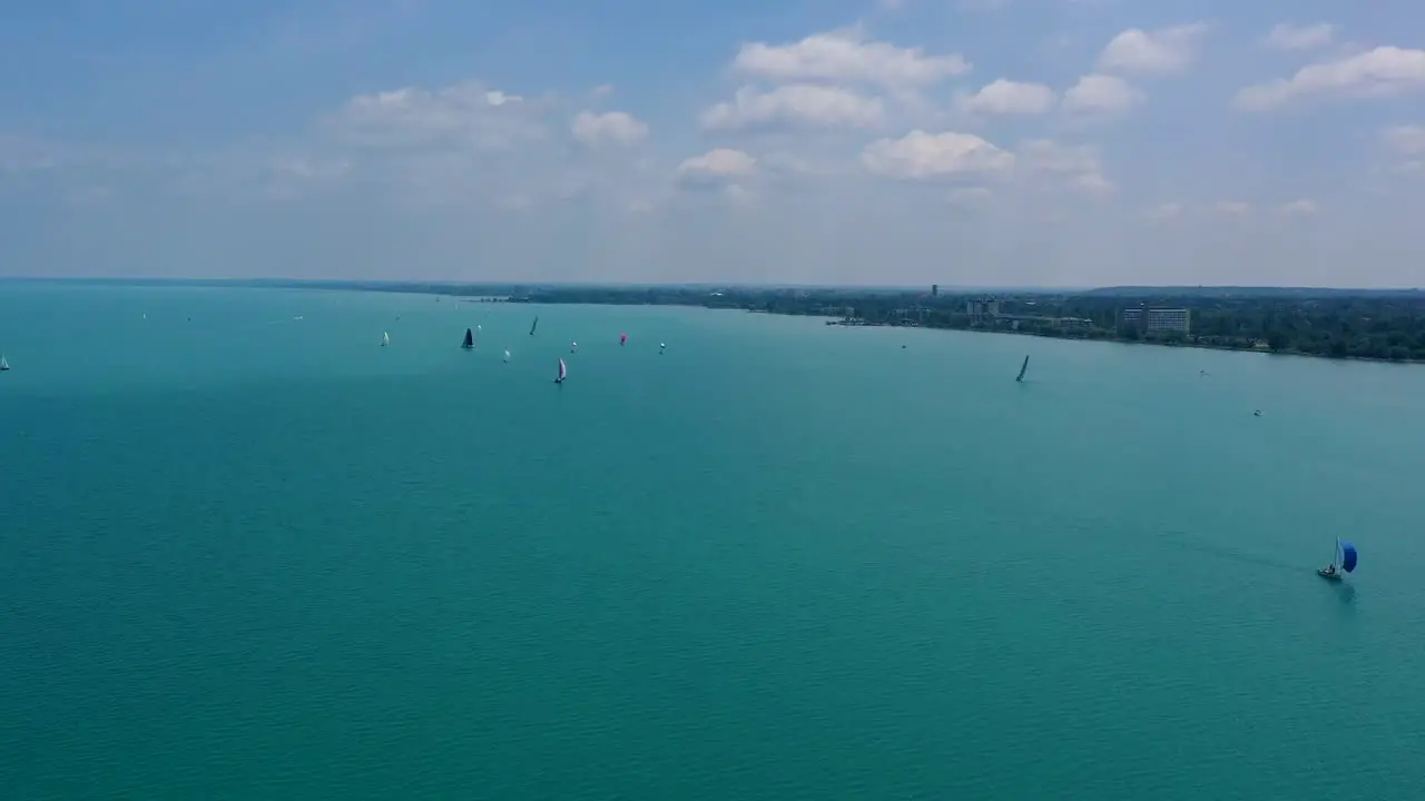 Drone time lapse from the lake Balaton with many sailing boats in nice weather 1