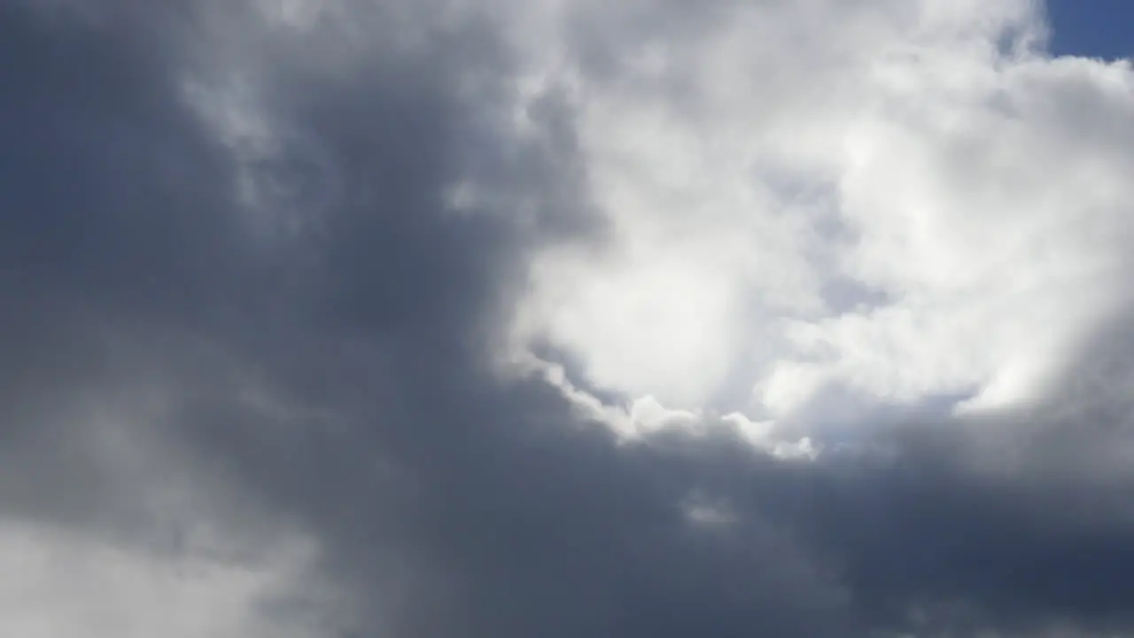 Clouds With Peaks Of Blue Sky Time Lapse