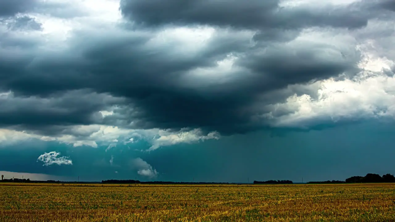 Tractors Harvesting Under Stormy Skies Timelapse