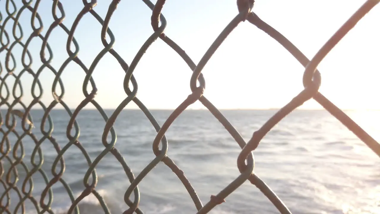 The Pacific Ocean through chainlink fence