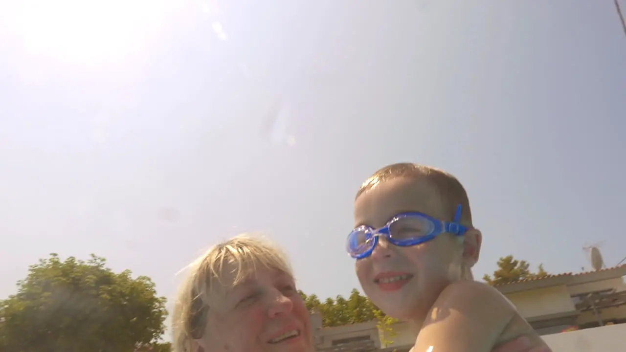 A boy and grandmother in the pool