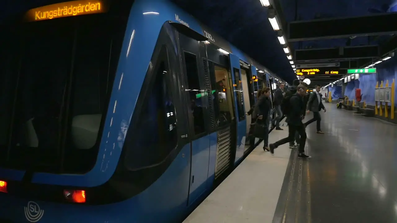 People getting off the subway train