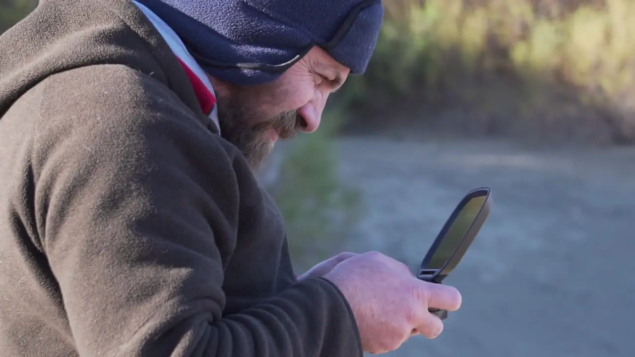 Drone Pilot looking at the screen of the command Lateral Medium Shot Slowmotion