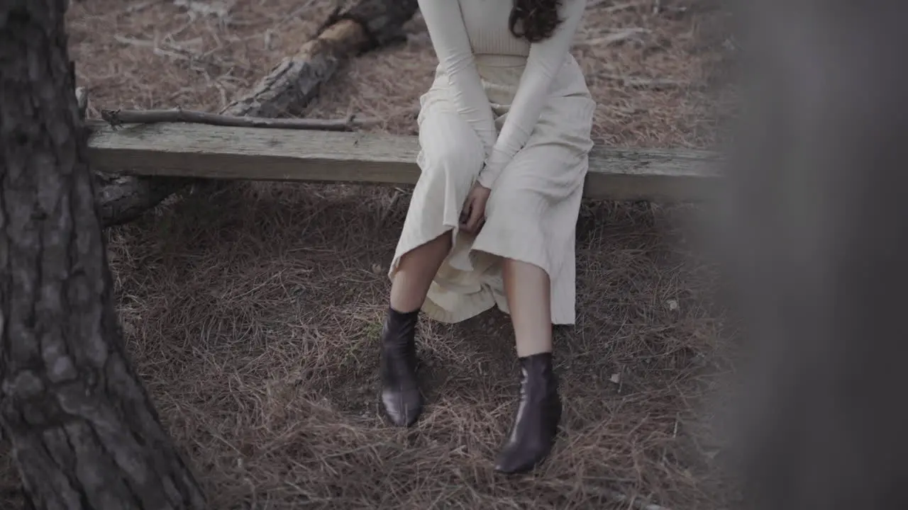 Fashionable spanish woman in long dress in boots