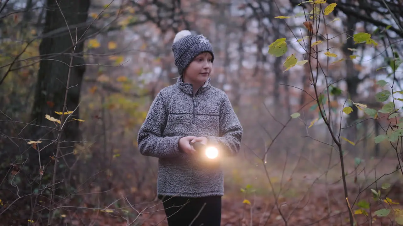 A Little Girl Walks Through A Dark Forest With A Flashlight In Her Hand Get Lost In The Forest Conce