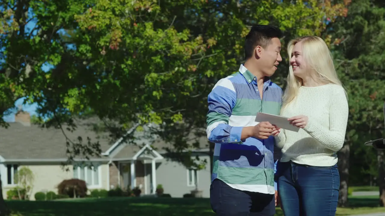 Happy Couple Open Their Mail