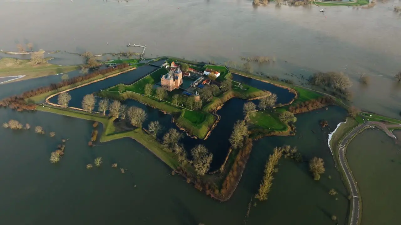 Iconic Loevestein castle in Poederoijen surrounded by floodwaters